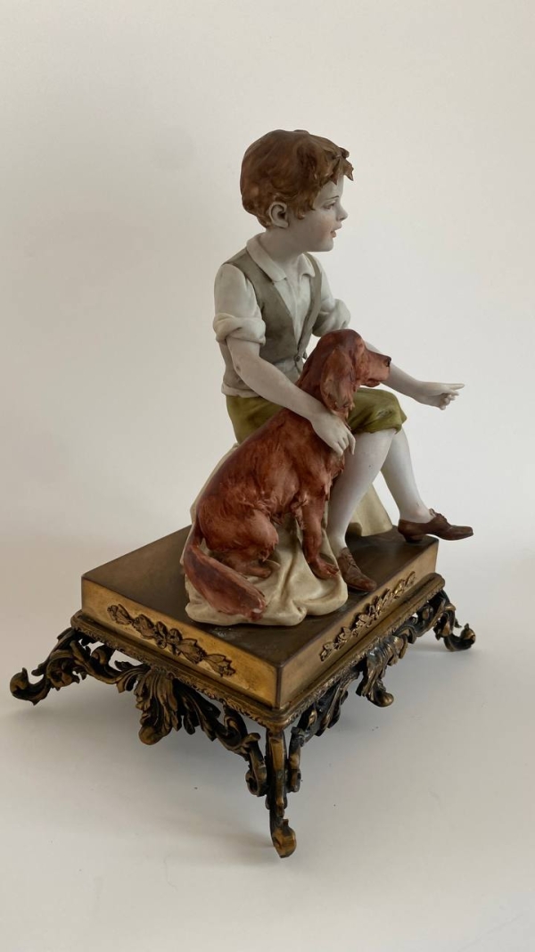 “Boy and Dog” Figurine by Luigi Benacchio